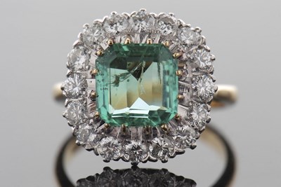 Lot 398 - An 18ct emerald and diamond ring, the asscher...