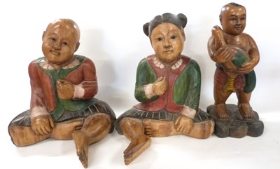 Lot 280 - A group of three wooden carved Chinese...