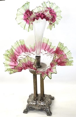 Lot 301 - Epergne mounted on four column white metal mounts