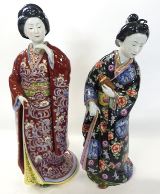 Lot 312 - A pair of continental porcelain figures of...