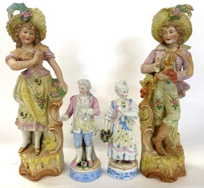 Lot 329 - A large pair of continental bisque figurines...