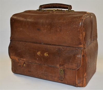 Lot 152 - A brown leather dressing bag by Alexander...