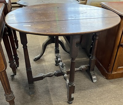 Lot 611 - A 18th century red walnut oval top table...