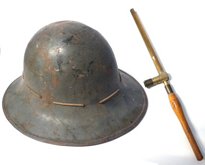 Lot 455 - First World War helmet together with a trench...