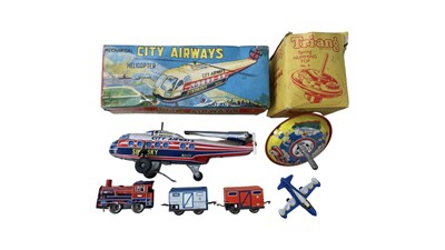 Lot 255 - A mixed lot of tin plate mechanical toys, to...