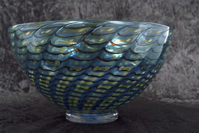 Lot 31 - A Kosta Boda glass bowl with a swirl design in...