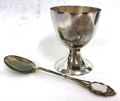 Lot 11 - A cased white metal egg cup and spoon, both...