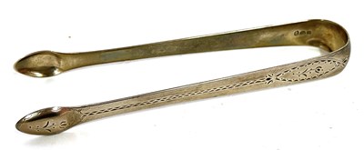 Lot 35 - Pair of George III silver sugar tongs with...