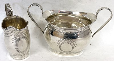 Lot 44 - An Edwardian silver twin handled sugar bowl of...