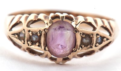 Lot 72A - A 9ct amethyst and seed pearl ring, the oval...