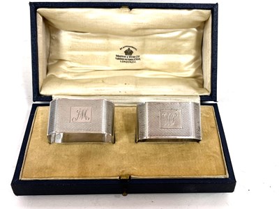 Lot 54 - Cased pair of Art Deco silver serviette rings...