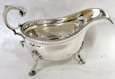 Lot 55 - An Edwardian silver sauce boat of typical form...