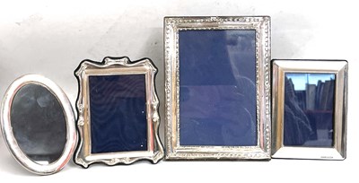 Lot 61 - Four silver photograph frames to include a...