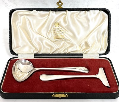 Lot 102 - A cased silver child's spoon and pusher,...