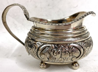 Lot 147 - George III silver cream jug of oval form,...