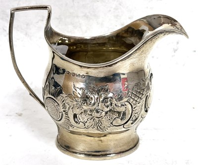 Lot 149 - George III silver cream jug of oval form, the...