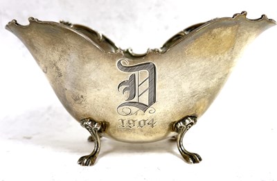 Lot 158 - A sterling marked sugar bowl of shaped oval...