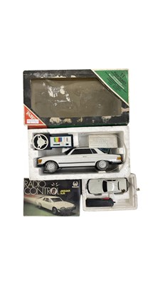 Lot 405 - A pair of boxed radio controlled cars, to...