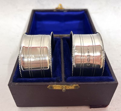 Lot 227 - A pair of Edwardian silver serviette rings...