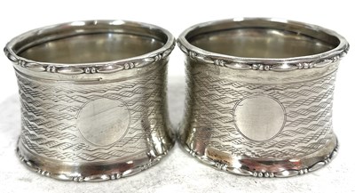 Lot 245 - Pair of George V silver serviette rings both...