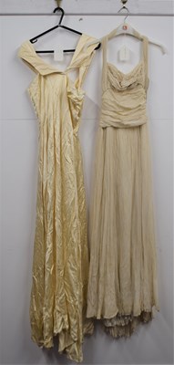 Lot 23 - A custom made cream chiffon overlay gown, with...