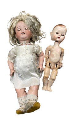 Lot 226 - A pair of dolls, to include: - A German AM...