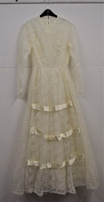 Lot 56 - A 1970's / 80's cream wedding dress, with...