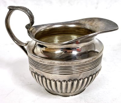 Lot 288 - George V silver cream jug of circular form...