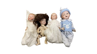 Lot 318 - Four small European bisque head dolls, to...