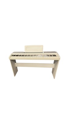 Lot 240 - A KORG SP-170S Digital piano in white, with...