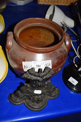 Lot 182 - CAST IRON DOOR STOP AND A BROWN GLAZED...