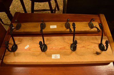 Lot 403 - TWO WOODEN BACKED COAT RACKS, LARGEST 55CM WIDE
