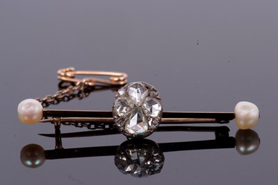 Lot 370 - A diamond and 'pearl' bar brooch, the centre...