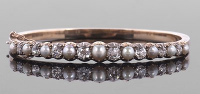 Lot 374 - A 'pearl' and diamond bangle, the alternating '...