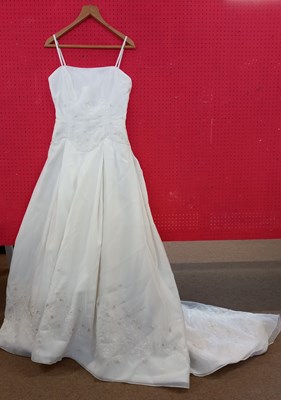 Lot 58 - A cream embroidered wedding gown, with cream...