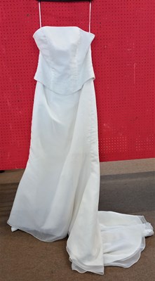 Lot 59 - A cream satin wedding gown, with strapless...