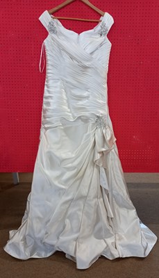 Lot 62 - A cream satin off-the-shoulder wedding gown by...