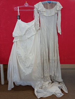 Lot 66 - Two wedding dresses, to include a cream satin...