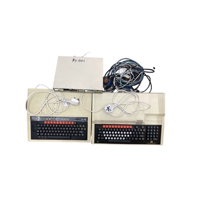 Lot 393 - A pair of 1980s BBC microcomputers, with a...