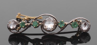 Lot 369 - An emerald and diamond brooch, set with a...