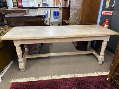 Lot 553 - 20th Century continental limed oak dining...