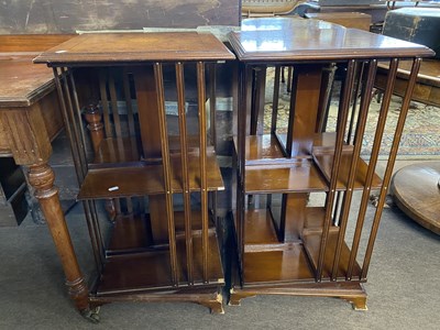 Lot 606 - Pair of reproduction revolving bookcase...