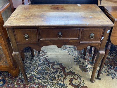 Lot 615 - 18th Century walnut low boy with three drawers...