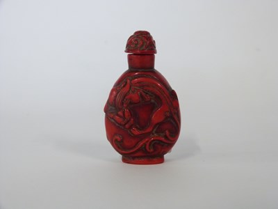 Lot 253 - Chinese scent bottle, red coloured carved with...