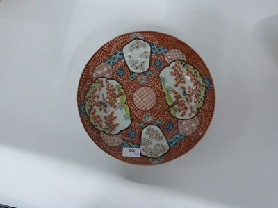 Lot 302 - An unusual Japanese porcelain dish of shaped...