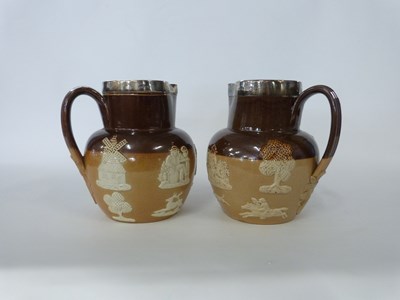 Lot 335 - Two Doulton Lambeth harvest jugs with...