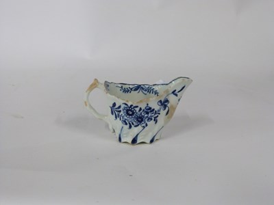 Lot 425 - Lowestoft butter boat of Low Chelsea ewer form...