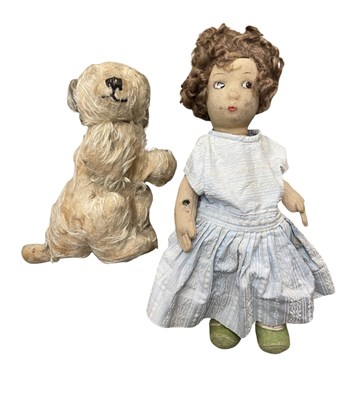 Lot 326 - A vintage cloth body doll and dog soft toy.