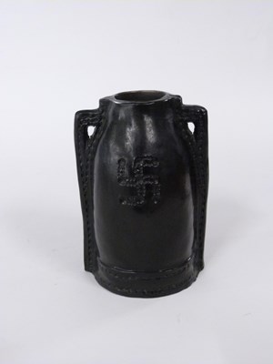 Lot 455 - An unusual Doulton slip cast vase with black...