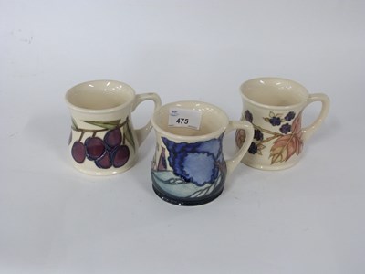 Lot 475 - Three Moorcroft pottery tankards including...